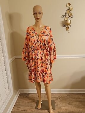 Floral V‑Neck Ruffle Sleeve Dress in Peach